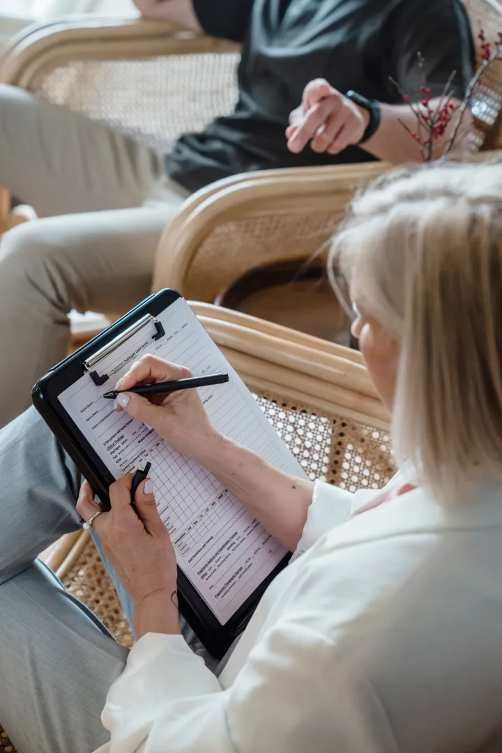 Therapist with intake form